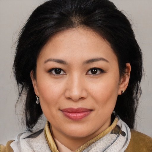 Joyful asian young-adult female with medium  brown hair and brown eyes
