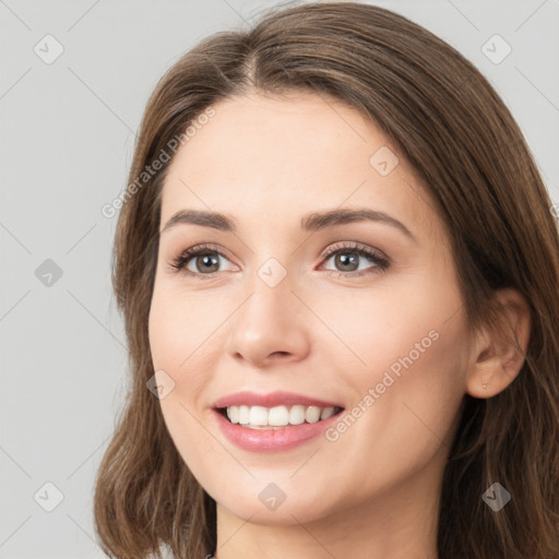 Joyful white young-adult female with long  brown hair and grey eyes