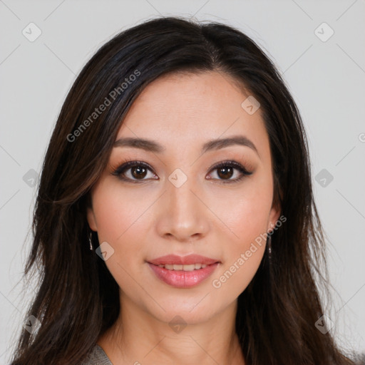 Joyful asian young-adult female with long  brown hair and brown eyes