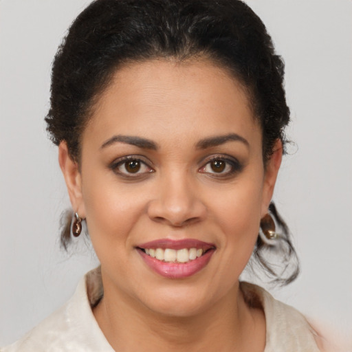 Joyful latino young-adult female with short  brown hair and brown eyes