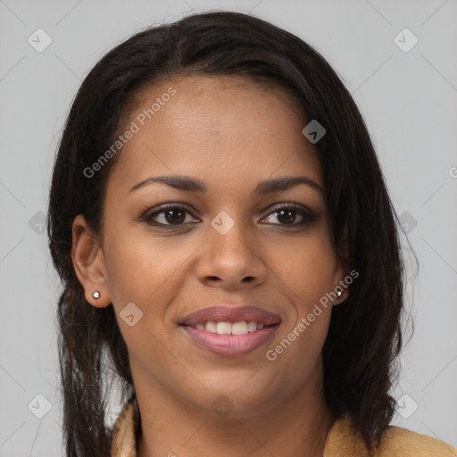 Joyful black young-adult female with long  brown hair and brown eyes