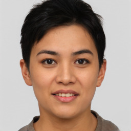 Joyful asian young-adult female with short  brown hair and brown eyes