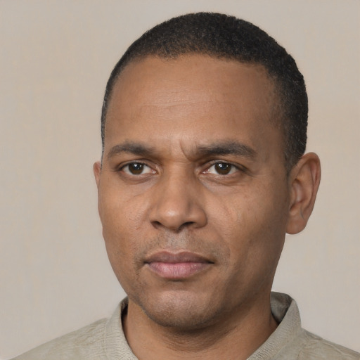 Neutral black adult male with short  black hair and brown eyes