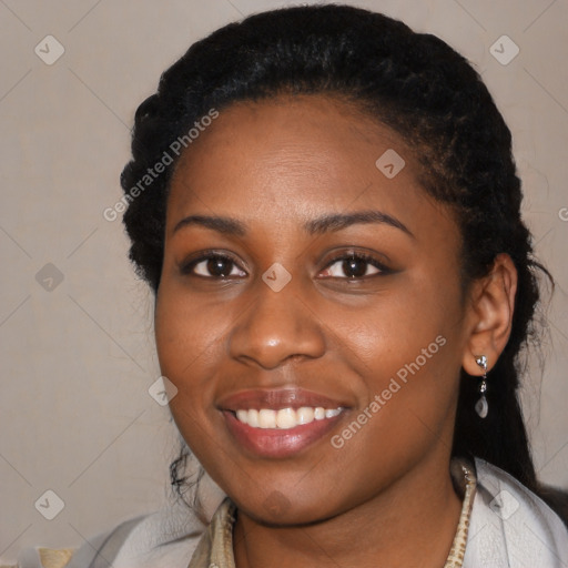 Joyful black young-adult female with short  black hair and brown eyes