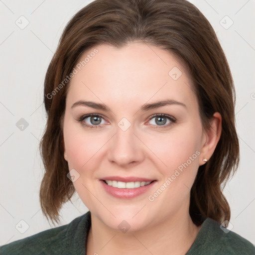 Joyful white young-adult female with medium  brown hair and green eyes