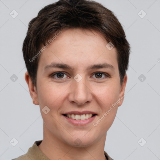 Joyful white young-adult female with short  brown hair and grey eyes