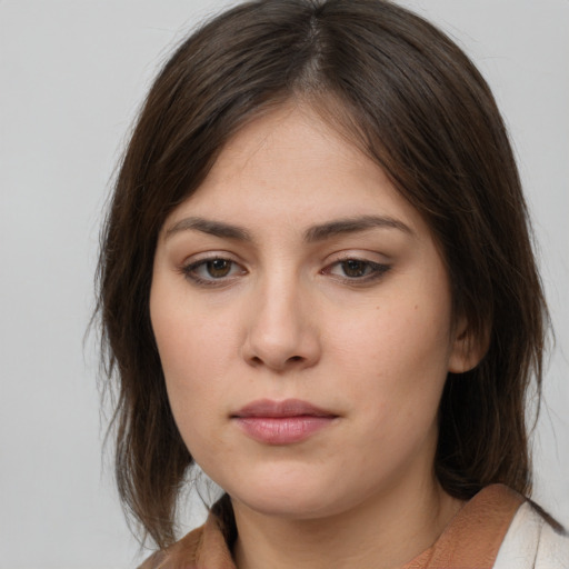 Neutral white young-adult female with medium  brown hair and brown eyes