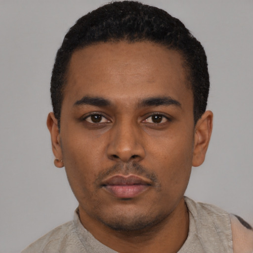 Neutral latino young-adult male with short  black hair and brown eyes