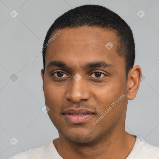 Joyful black young-adult male with short  black hair and brown eyes