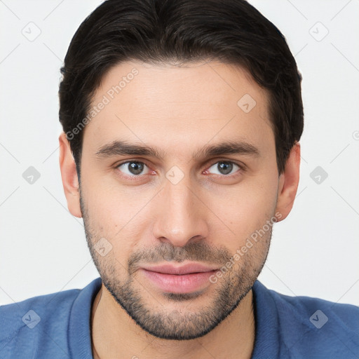 Joyful white young-adult male with short  brown hair and brown eyes