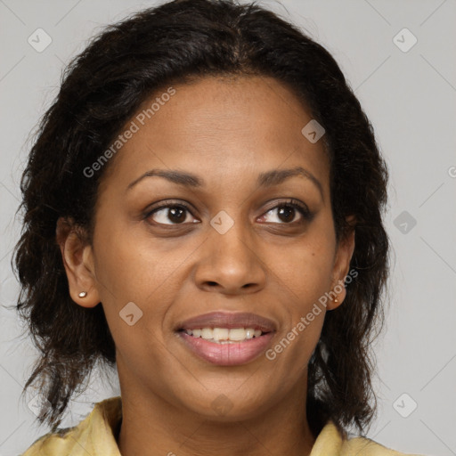 Joyful black young-adult female with long  brown hair and brown eyes