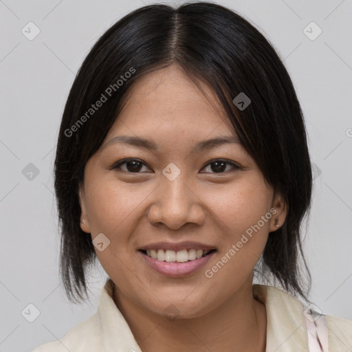 Joyful latino young-adult female with medium  brown hair and brown eyes