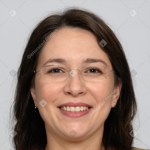 Joyful white adult female with long  brown hair and brown eyes