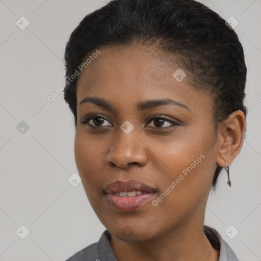 Joyful black young-adult female with short  black hair and brown eyes