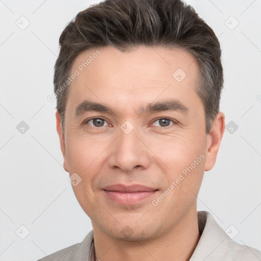 Joyful white adult male with short  brown hair and brown eyes