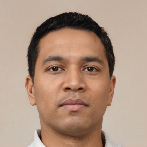 Neutral latino young-adult male with short  black hair and brown eyes