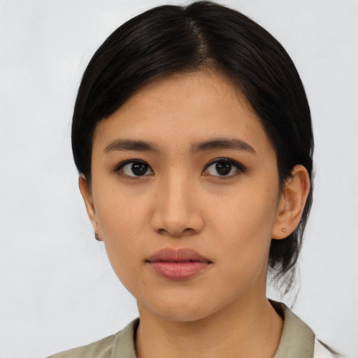 Neutral asian young-adult female with medium  black hair and brown eyes