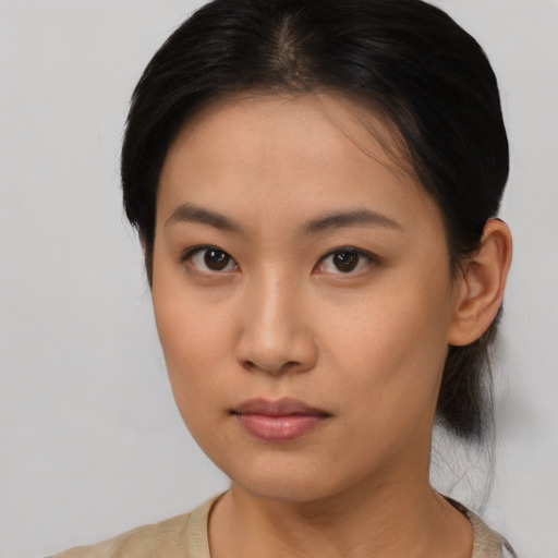 Neutral asian young-adult female with medium  brown hair and brown eyes