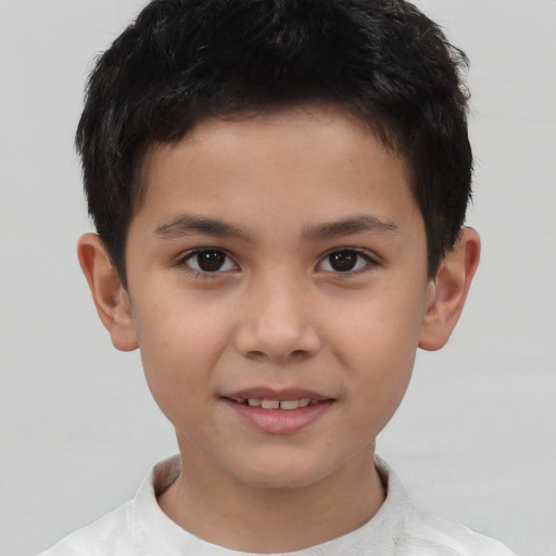 Joyful asian child male with short  brown hair and brown eyes