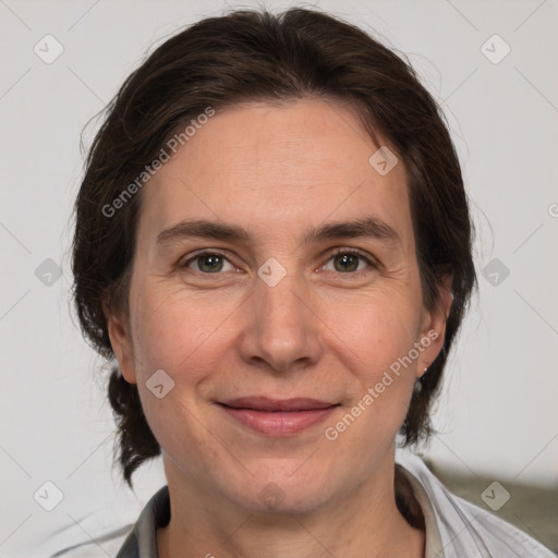 Joyful white adult female with medium  brown hair and brown eyes