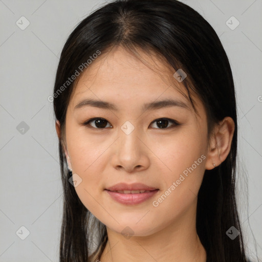 Joyful asian young-adult female with long  brown hair and brown eyes