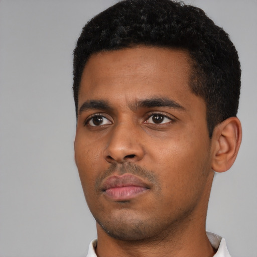 Neutral black young-adult male with short  black hair and brown eyes