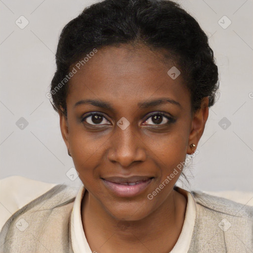 Joyful black young-adult female with short  black hair and brown eyes