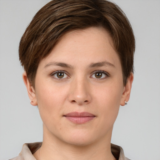 Joyful white young-adult female with short  brown hair and grey eyes