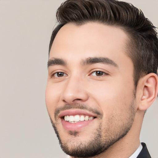 Joyful white young-adult male with short  black hair and brown eyes