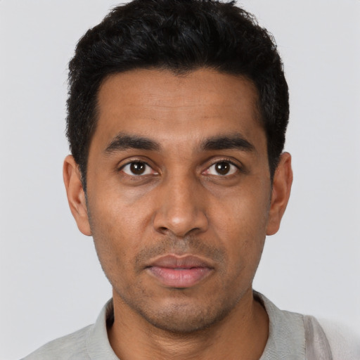 Neutral latino young-adult male with short  black hair and brown eyes