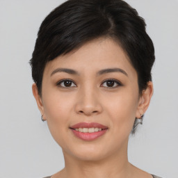 Joyful asian young-adult female with short  brown hair and brown eyes