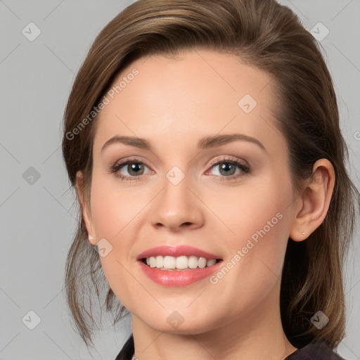 Joyful white young-adult female with long  brown hair and blue eyes