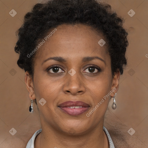 Joyful black adult female with short  brown hair and brown eyes