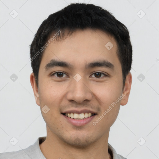 Joyful white young-adult male with short  black hair and brown eyes