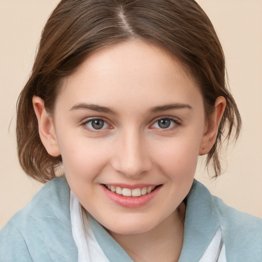 Joyful white child female with medium  brown hair and brown eyes