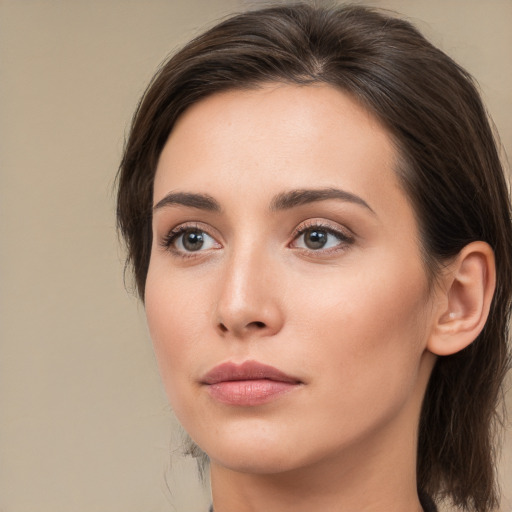 Neutral white young-adult female with medium  brown hair and brown eyes