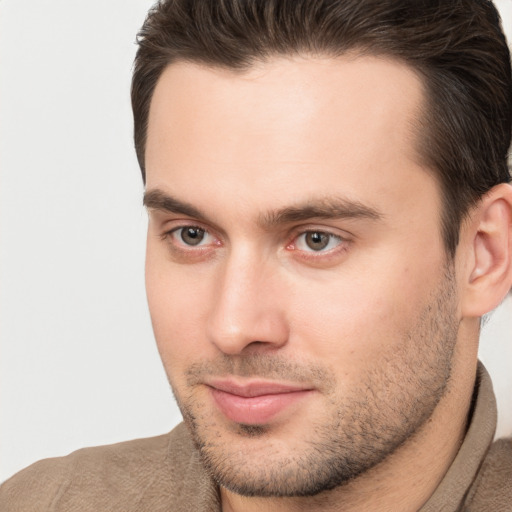 Joyful white young-adult male with short  brown hair and brown eyes