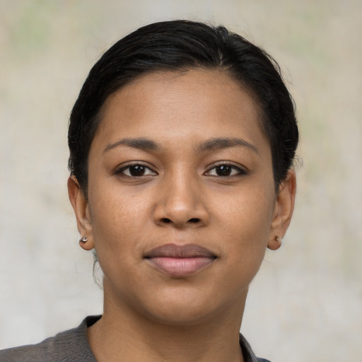 Neutral latino young-adult female with short  black hair and brown eyes