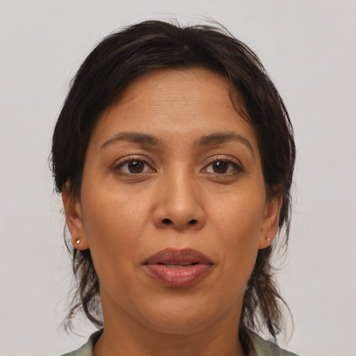 Joyful asian adult female with medium  brown hair and brown eyes