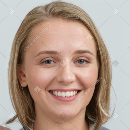 Joyful white young-adult female with medium  brown hair and blue eyes