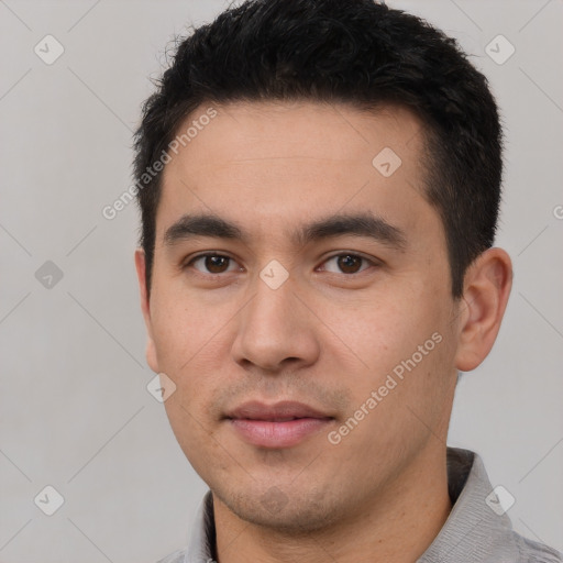 Joyful white young-adult male with short  black hair and brown eyes