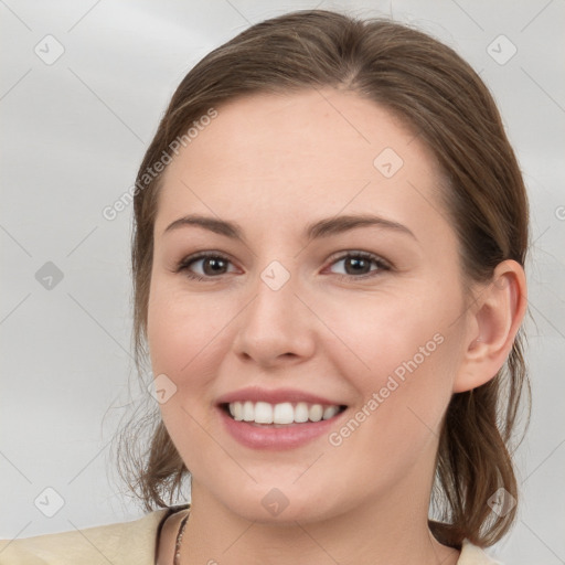 Joyful white young-adult female with medium  brown hair and grey eyes