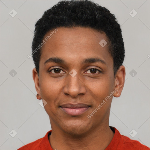 Joyful black young-adult male with short  black hair and brown eyes