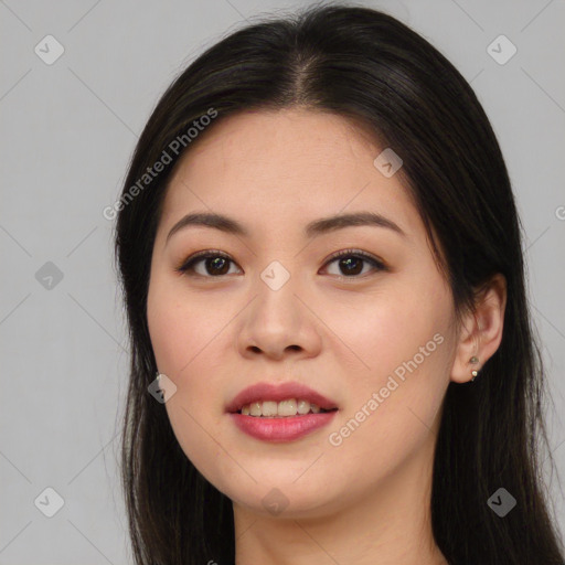 Joyful asian young-adult female with long  brown hair and brown eyes