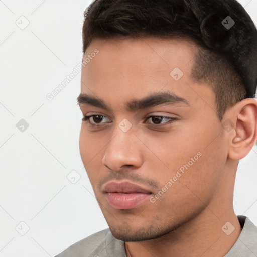 Neutral white young-adult male with short  black hair and brown eyes