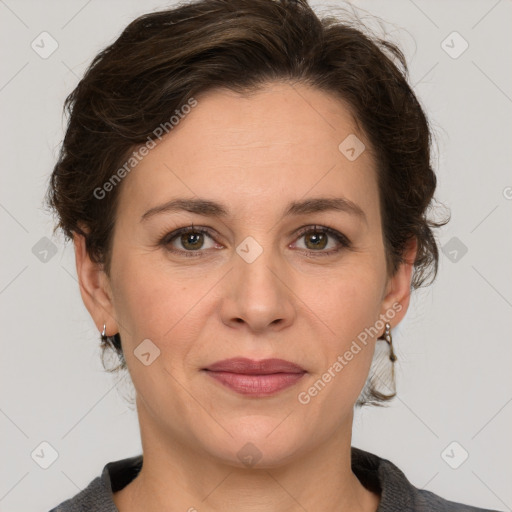 Joyful white adult female with medium  brown hair and grey eyes