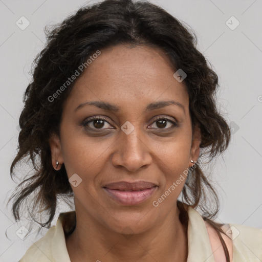 Joyful black adult female with medium  brown hair and brown eyes