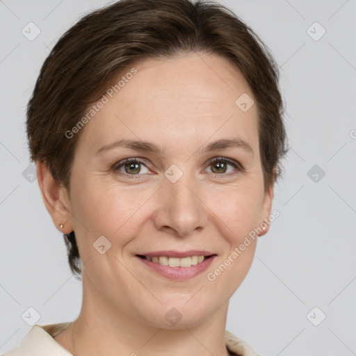 Joyful white adult female with short  brown hair and grey eyes