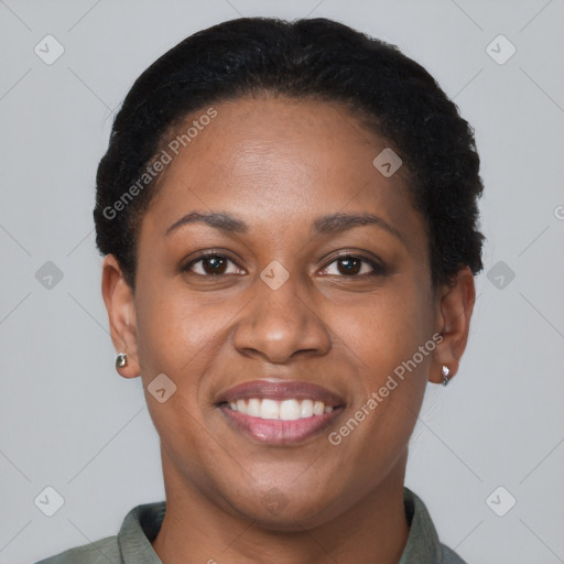 Joyful black young-adult female with short  brown hair and brown eyes