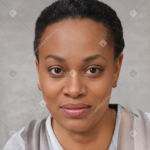 Joyful black young-adult female with short  brown hair and brown eyes